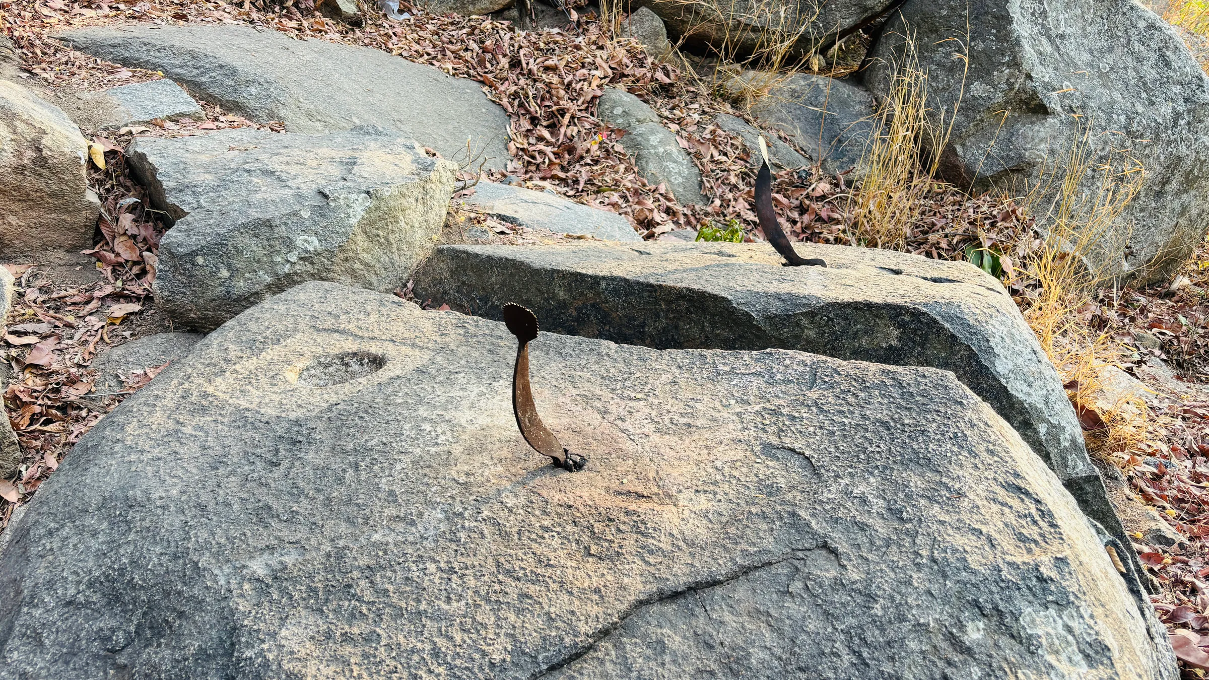 Iron blades fixed into the rocks near the Halu Chilume Gange temple